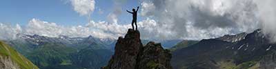 Standing on a rocky peak on the Casanna ridge, Albula Alps, Switzerland