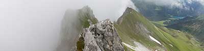 mist over the tricky ridge of the Casanna, Albula Alps, Switzerland