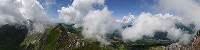 summit of the Casanna, Albula Alps with plenty clouds rising after a period of bad weather