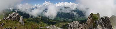 summit of the Casanna, Albula Alps with plenty clouds rising after a period of bad weather